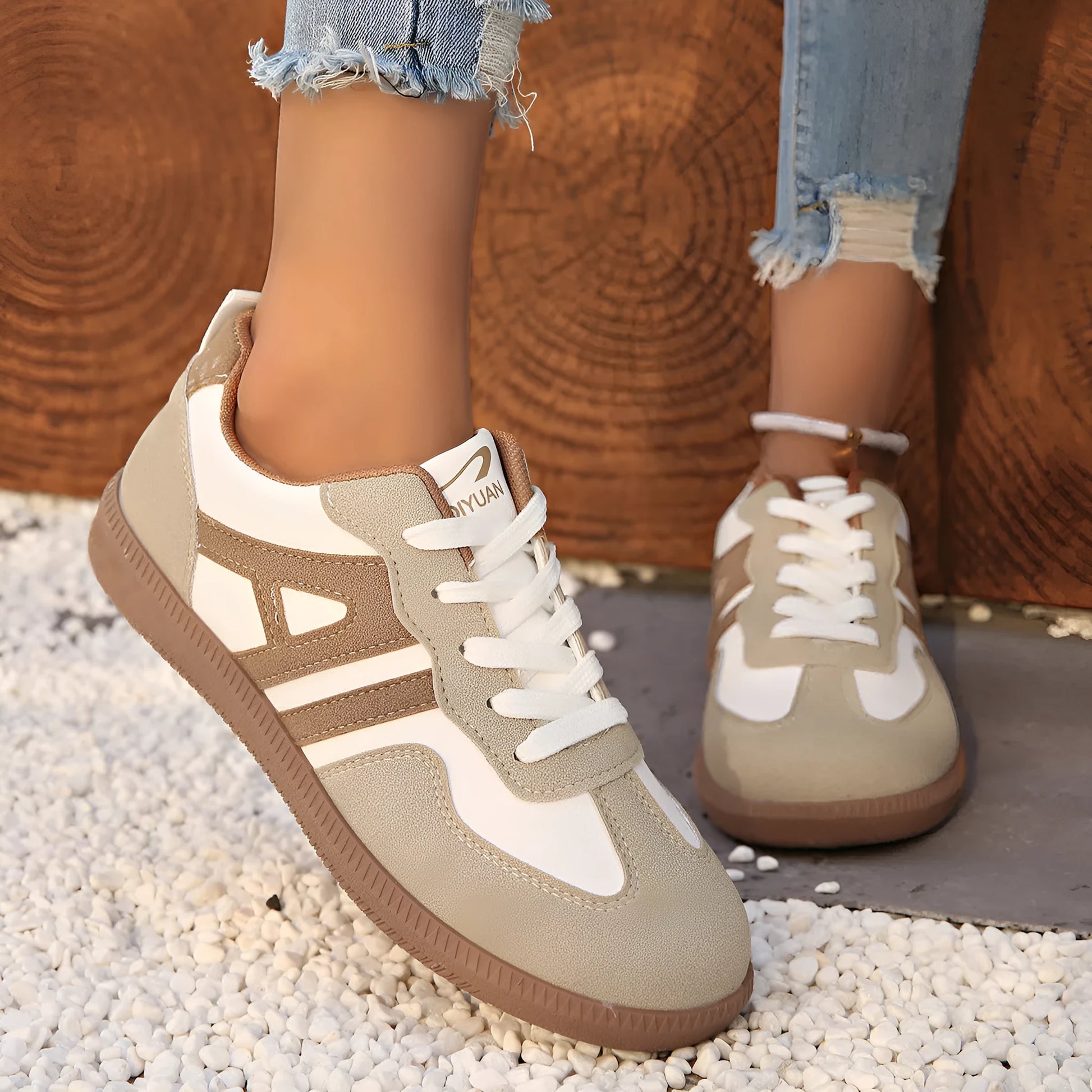 Women's retro lace-up jogging shoes in black, grey, and khaki with low platform heel.