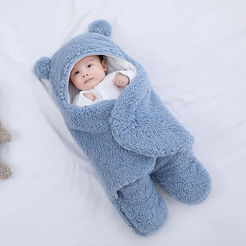 Cozy cotton baby sleeping bag with soft, breathable interior and warm, insulating outer layer
