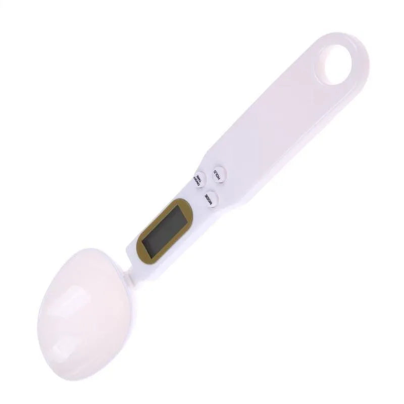 White digital spoon kitchen scale with LCD display showing weight measurement