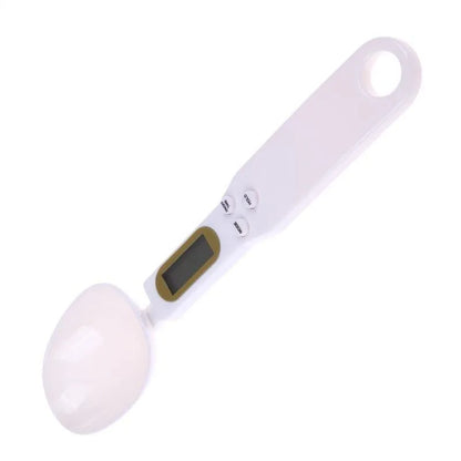 White digital spoon kitchen scale with LCD display showing weight measurement