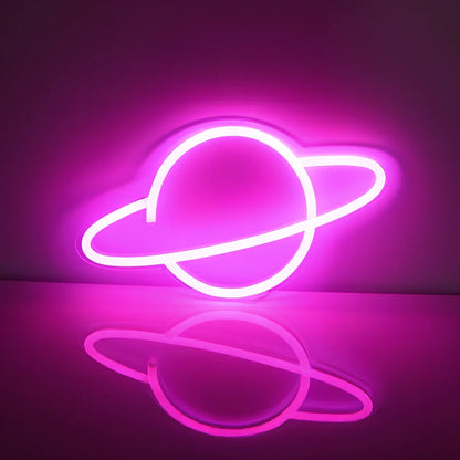 USB-powered neon wall lamp showing Banana shape with pink lighting against dark wall