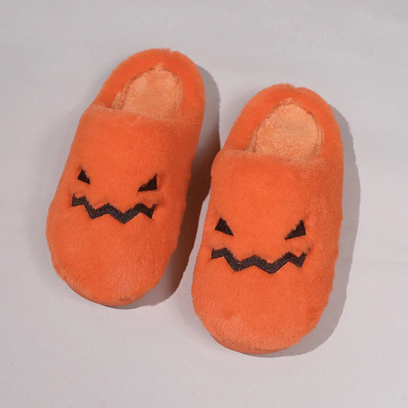Cozy pumpkin-shaped slippers in orange color with plush fabric and non-slip sole for comfortable indoor wear