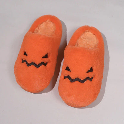 Cozy pumpkin-shaped slippers in orange color with plush fabric and non-slip sole for comfortable indoor wear