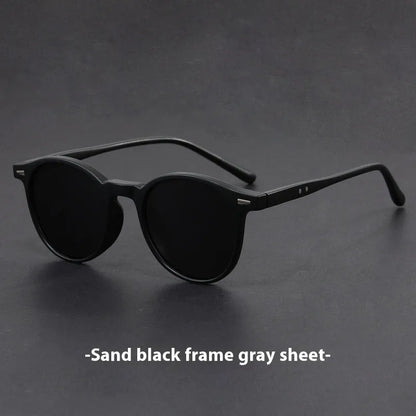Ultra-light round frame retro sunglasses with polarised grey lenses in multiple colour options