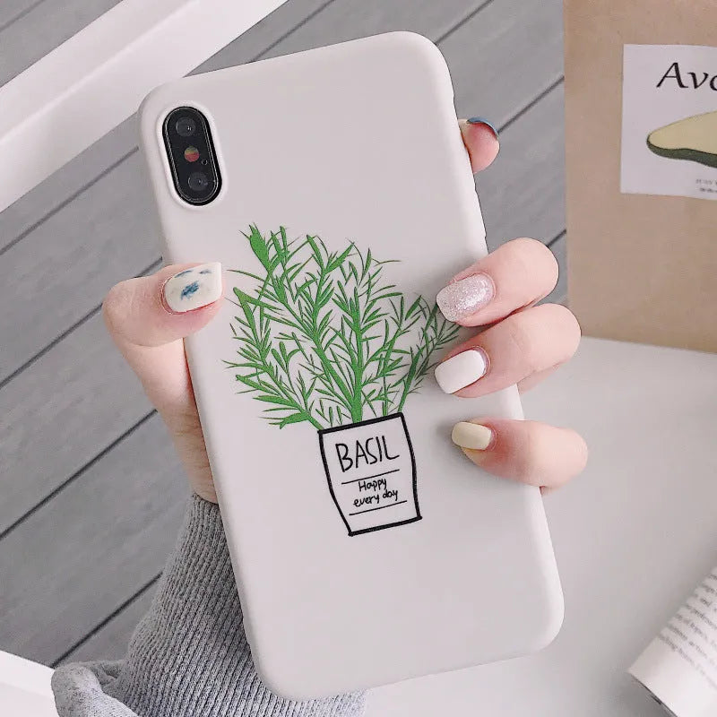 White silicone iPhone case with a painted green leaf plant design on the back.