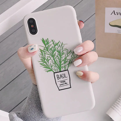 White silicone iPhone case with a painted green leaf plant design on the back.