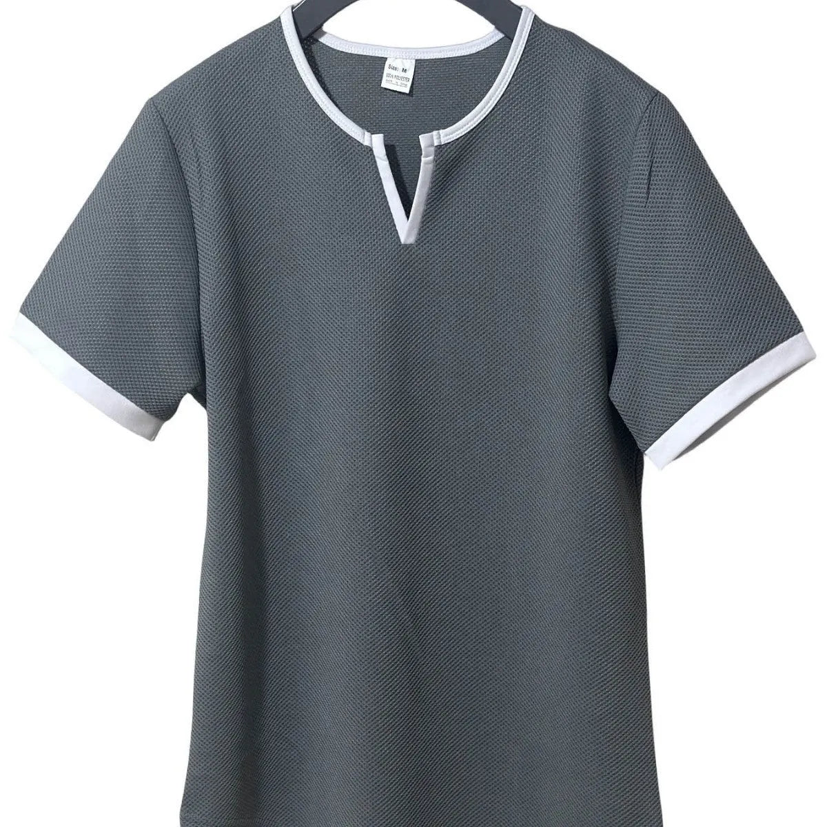 V-neck colour-block waffle texture outdoor sports T-shirt in polyester fabric on a neutral background.