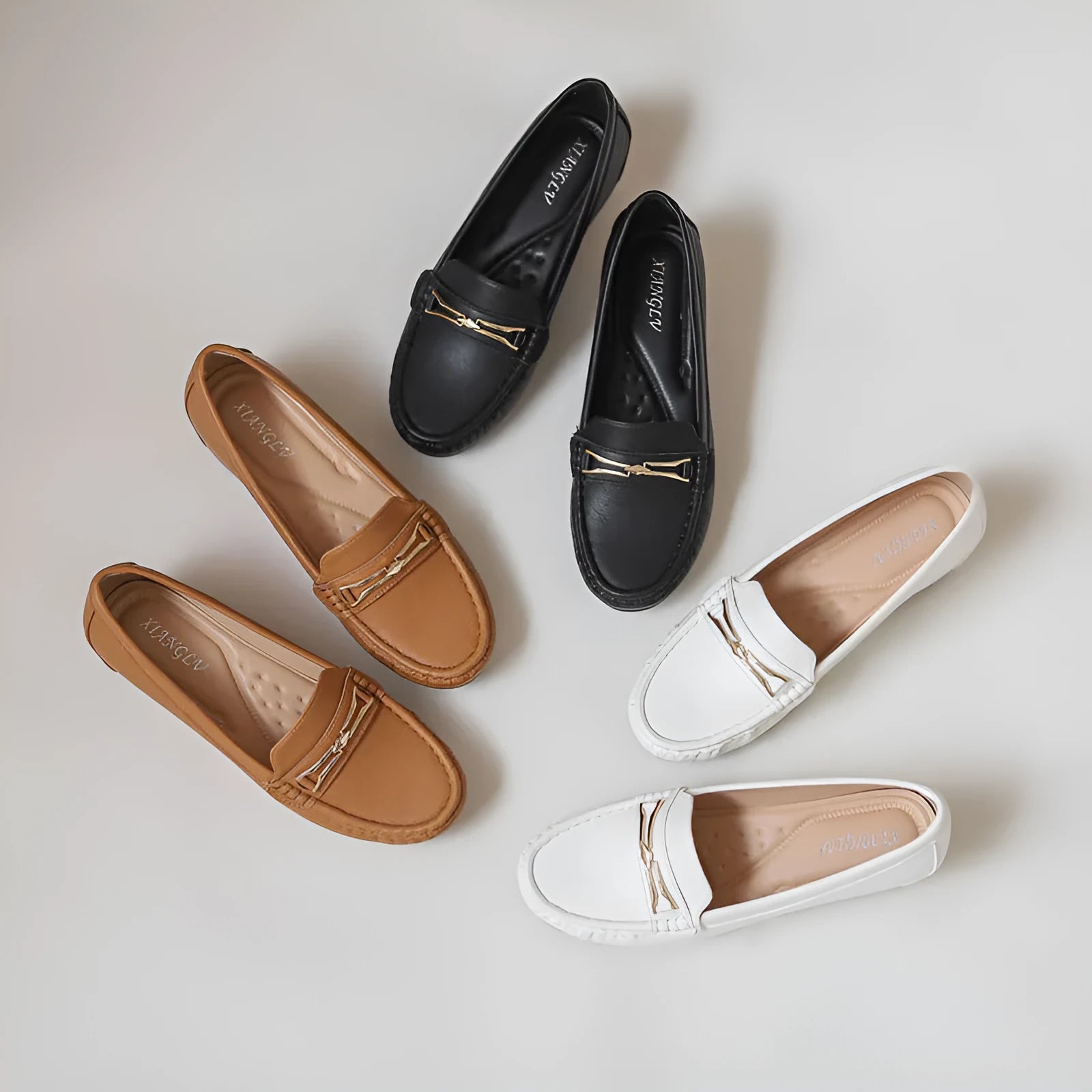 Casual height increasing slip-on shoes in black, brown, or white with round toe and soft rubber sole