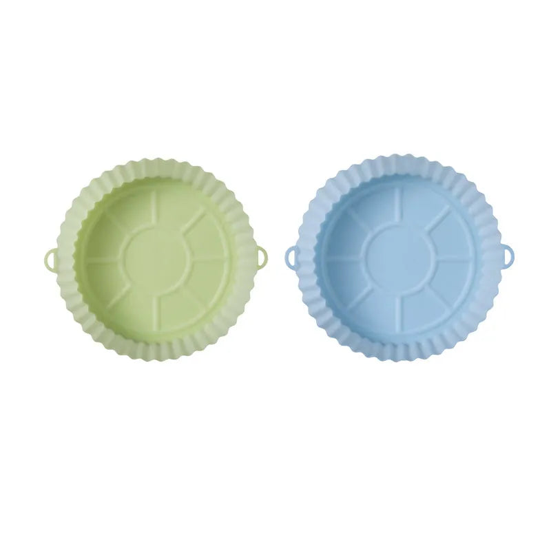 Round blue silicone baking tray mat with 4.5cm sides on a kitchen counter.
