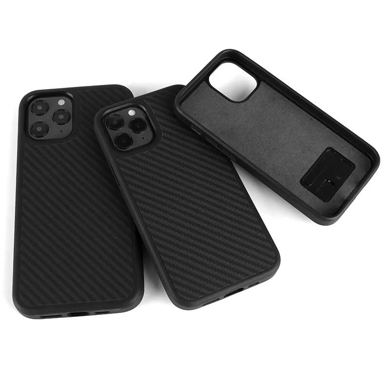 Black solid colour wooden iPhone case with TPU and Kevlar construction on a table.