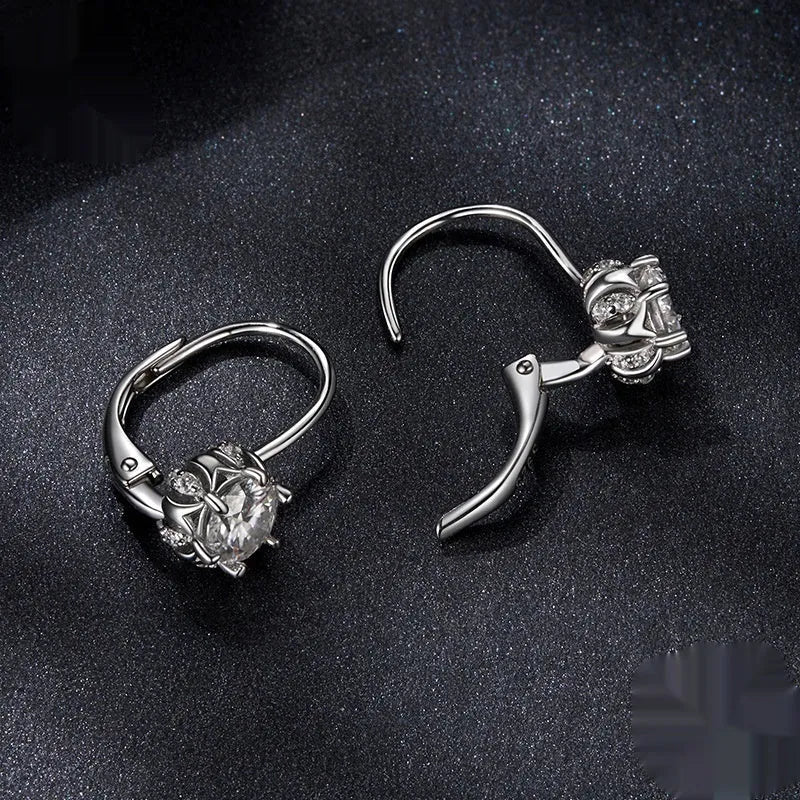 Sterling silver flower bud clip earrings with moissanite and white gold plating