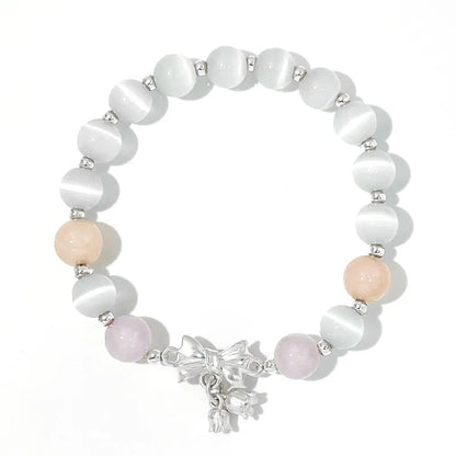 Lavender amethyst opal bracelet with crystal bowknot charm measuring 10mm