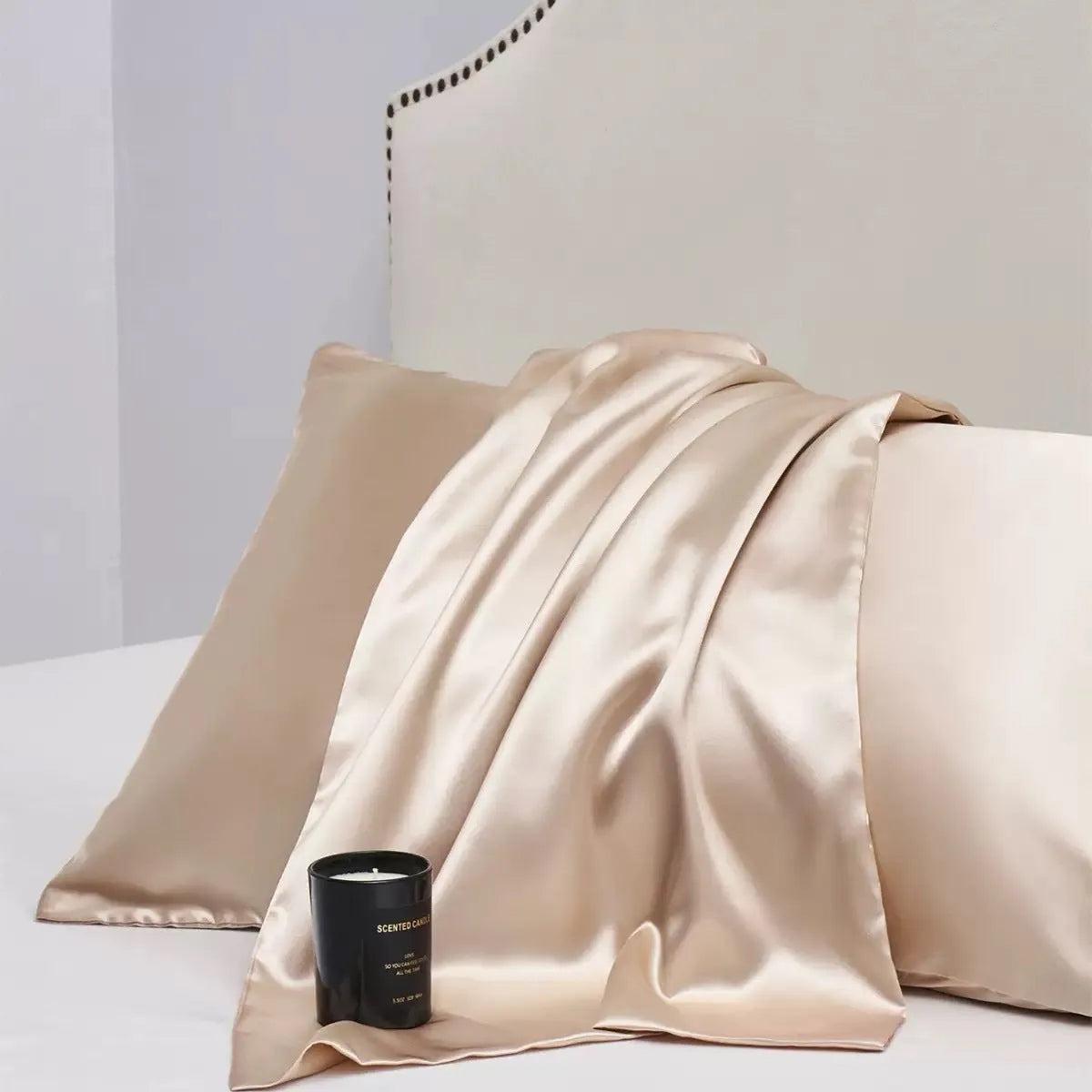 Pair of solid colour satin pillowcases showing smooth plain weave texture and reactive dye colour