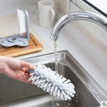 Grey suction cup brush with double-head design for cleaning cups and glasses