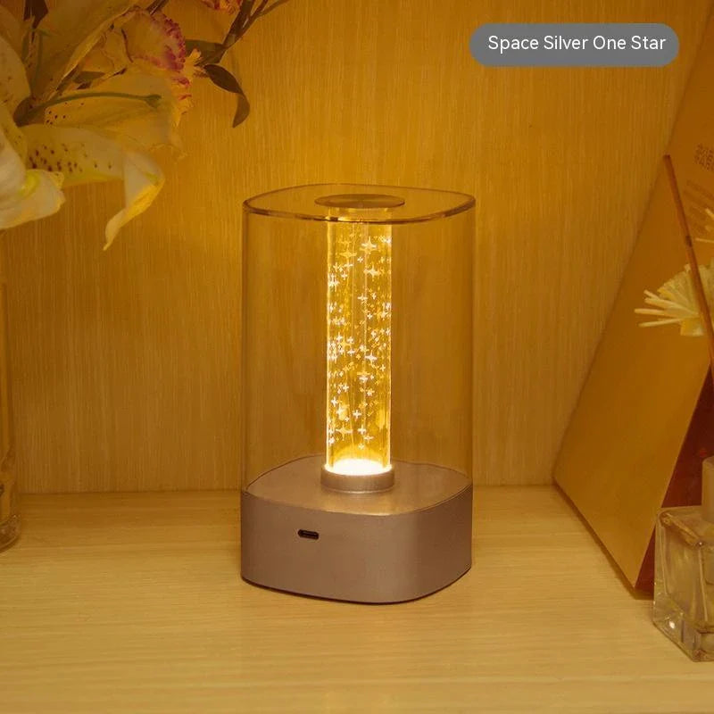 Elegant touch-controlled bedside lamp with soft, warm lighting, unique lamp post design, and wireless USB charging