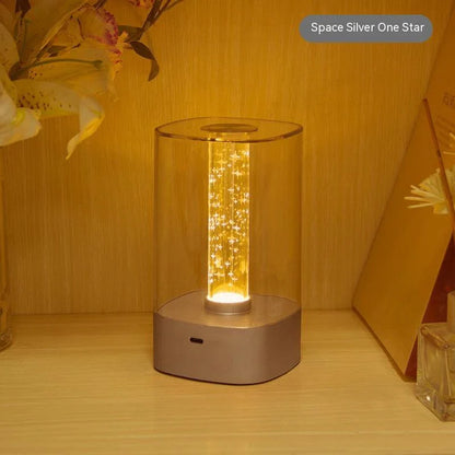 Elegant touch-controlled bedside lamp with soft, warm lighting, unique lamp post design, and wireless USB charging
