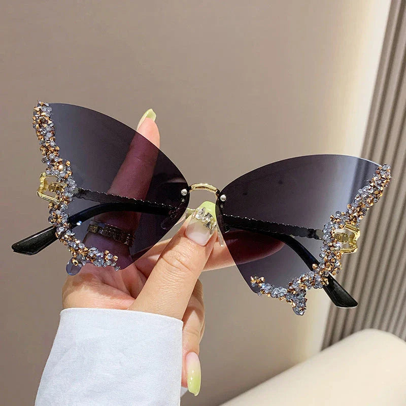Chic butterfly-shaped sunglasses with diamond accents in various gradient color options