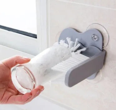 Grey suction cup brush with double-head design for cleaning cups and glasses