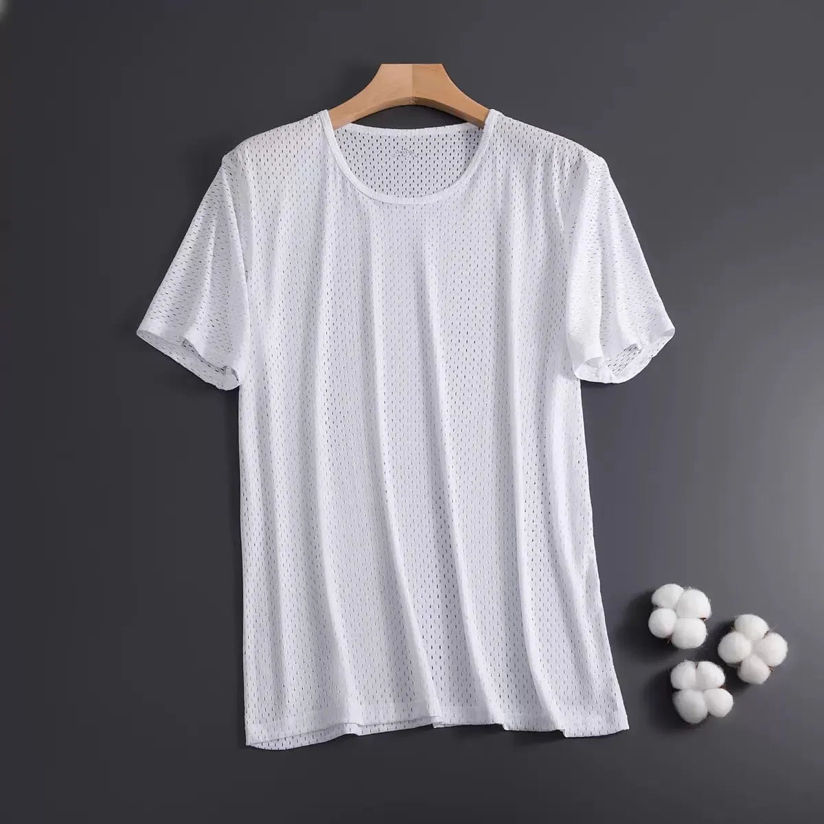 Man wearing a solid colour ice silk short sleeve t-shirt with a crew neck in a loose, casual fit for summer.