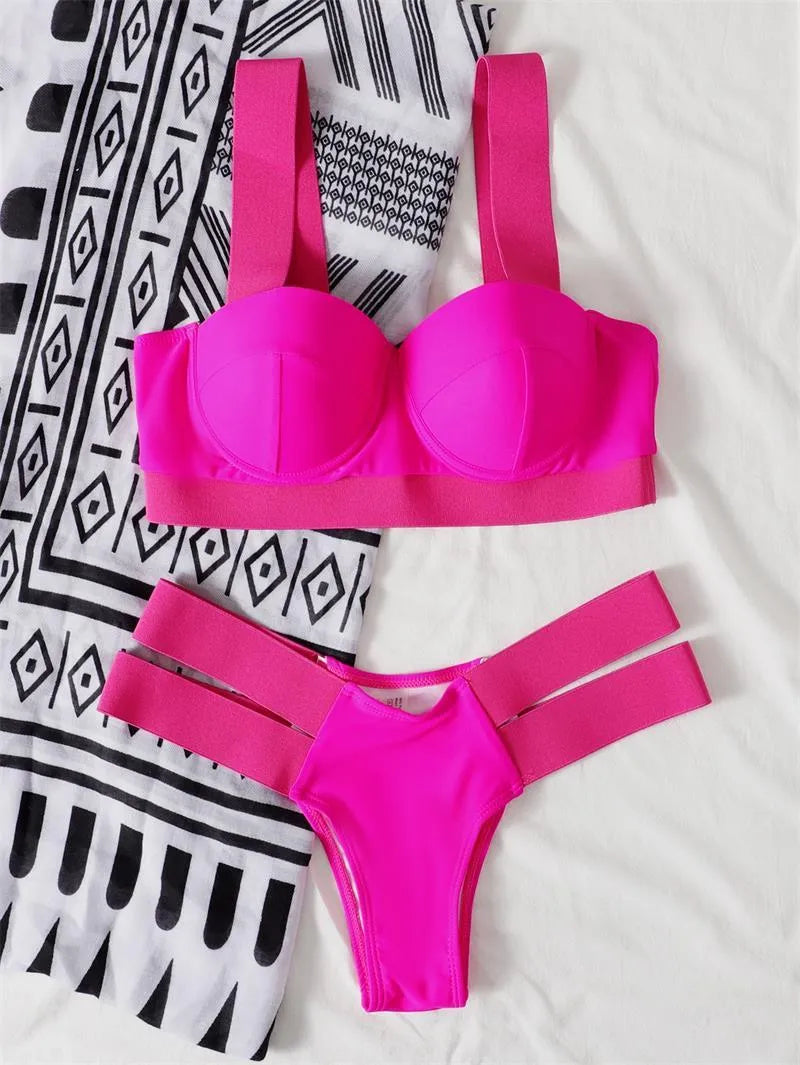 Women's rose red and black contrast colour bikini swimsuit with push-up support.