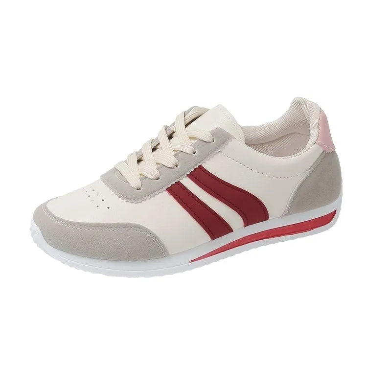 Blue and red low-top lace-up sneaker with soft rubber soles and mesh lining