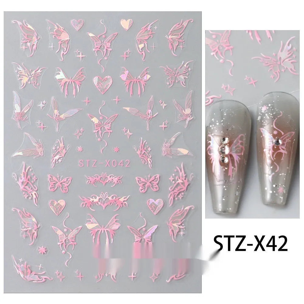 Assortment of black and silver nail sticker designs including cartoon and French tip patterns on a plastic sheet.