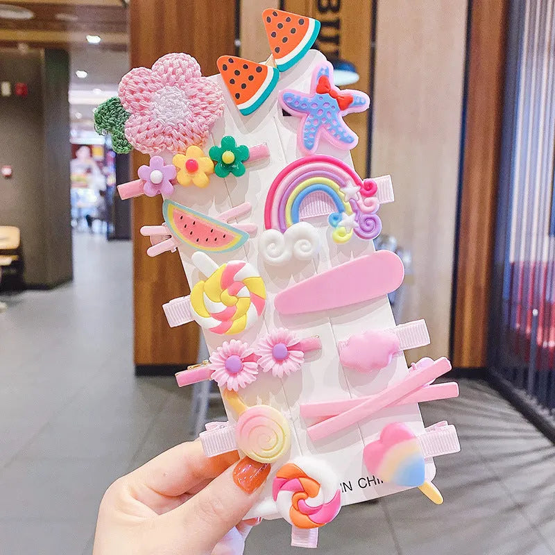 Assortment of colourful toddler hair clips and barrettes with candy, rainbow, fruit, and butterfly designs