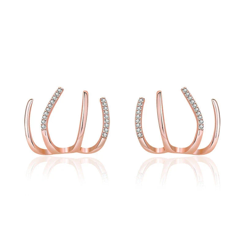 Pair of 925 sterling silver earrings with four-prong zircon stone settings in a geometric design