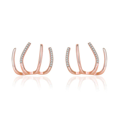 Pair of 925 sterling silver earrings with four-prong zircon stone settings in a geometric design