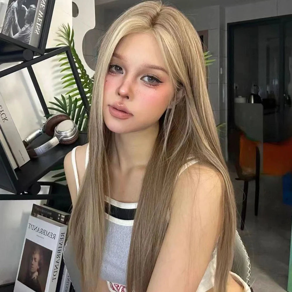 Forehead lace wig with golden brown gradient colour and centre-parted style on display