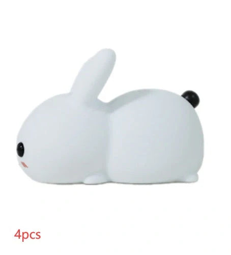 Rabbit-shaped silicone nightlight with warm amber and cool white dual colour illumination, perfect for bedside or home decor