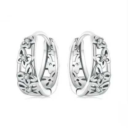 Sterling silver hollow butterfly earrings with zircon accents, retro design measuring 14mm by 5mm