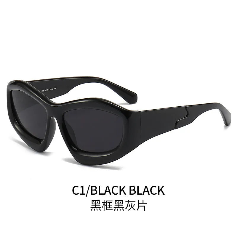 Outdoor unisex sunglasses with concave bubble lenses in black frame on a table.