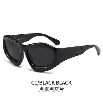 Outdoor unisex sunglasses with concave bubble lenses in black frame on a table.