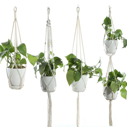 Handmade beige cotton rope net bag holding a plant pot, showing its textured sling design.