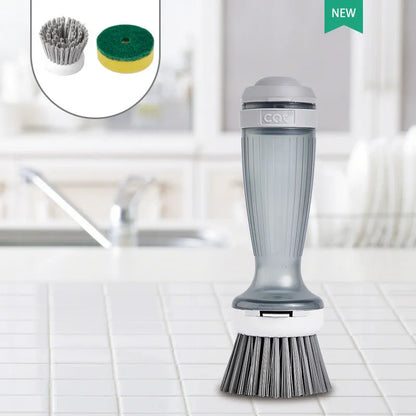 Milk white and mint green pot scrub brush with a soap dispenser handle and replaceable non-scratch bristles.