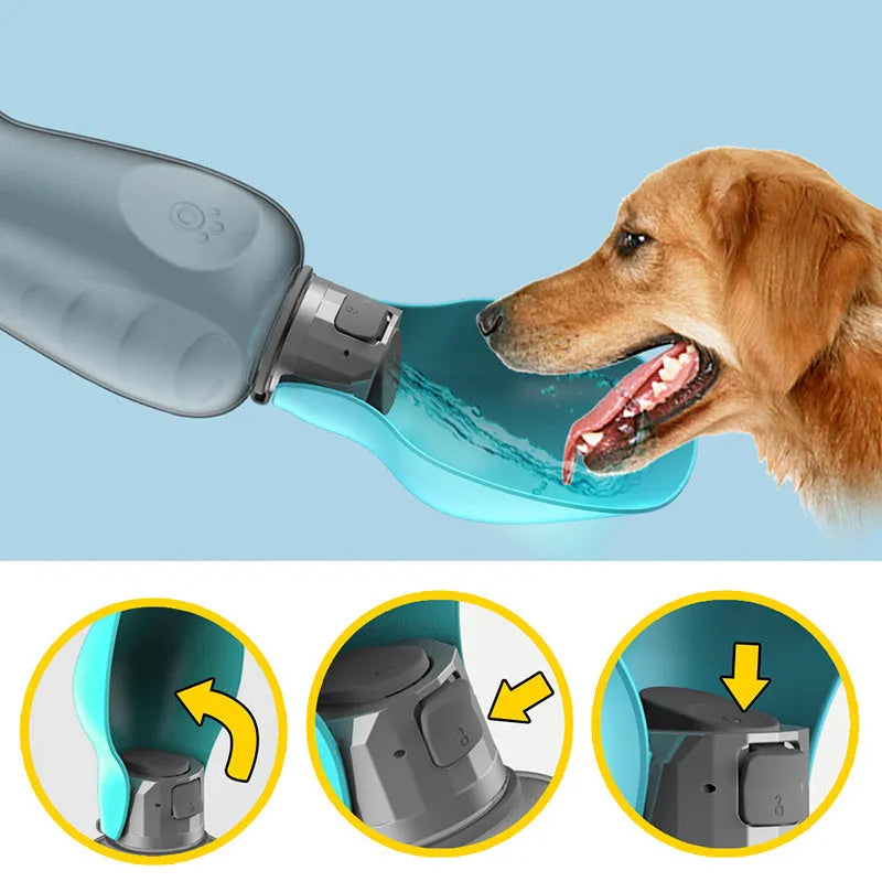Blue grey portable dog water bottle with fold-out drinking bowl, shown with a wrist strap.