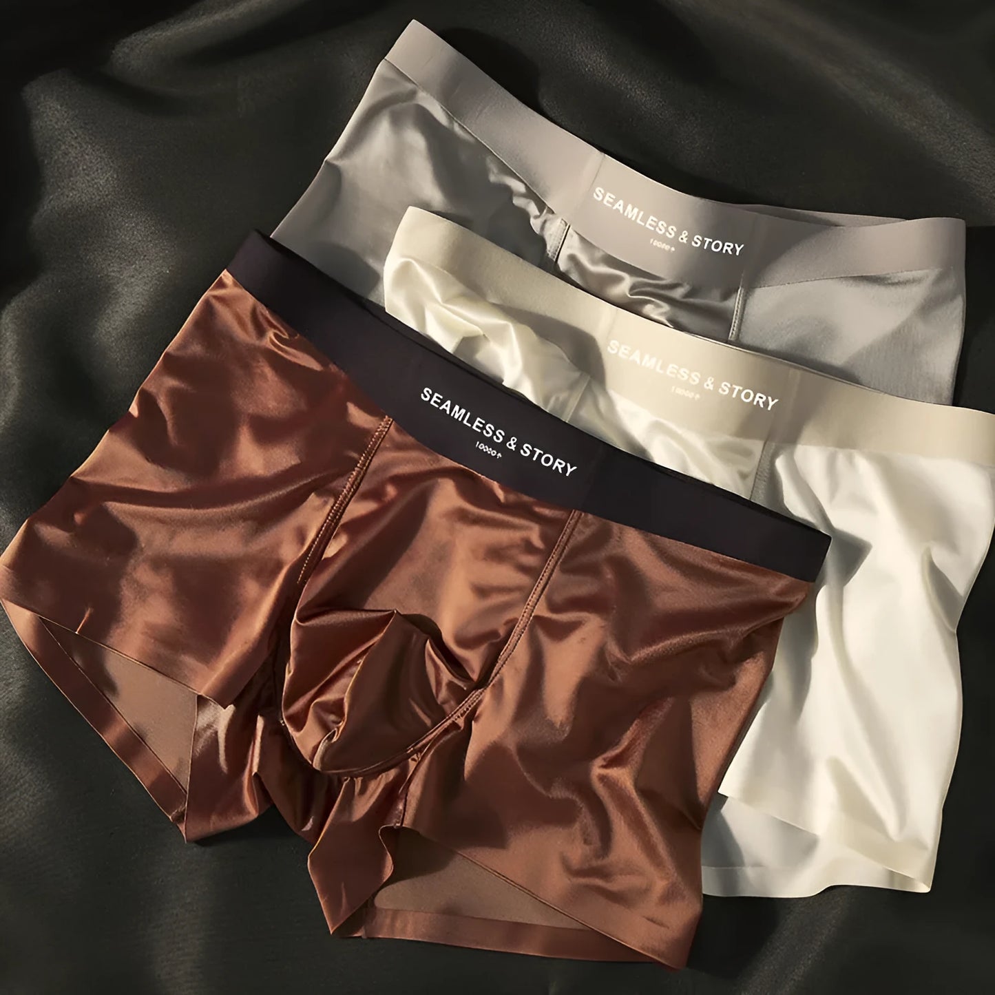 Men's solid colour satin ice silk boxer shorts laid flat, showing mid-waist design.