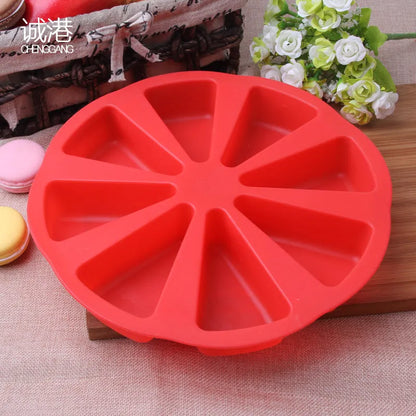 Green silicone cake mould measuring 7 by 4.5 centimetres on a baking tray.