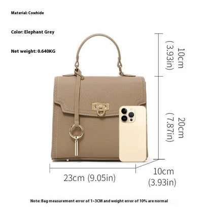 Elephant grey vintage handbag with lock detail and file organisation inside