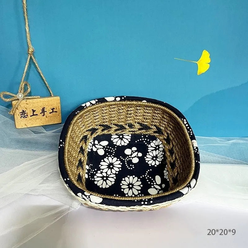 Blue square plastic storage basket with hand-woven sides for organising household items.