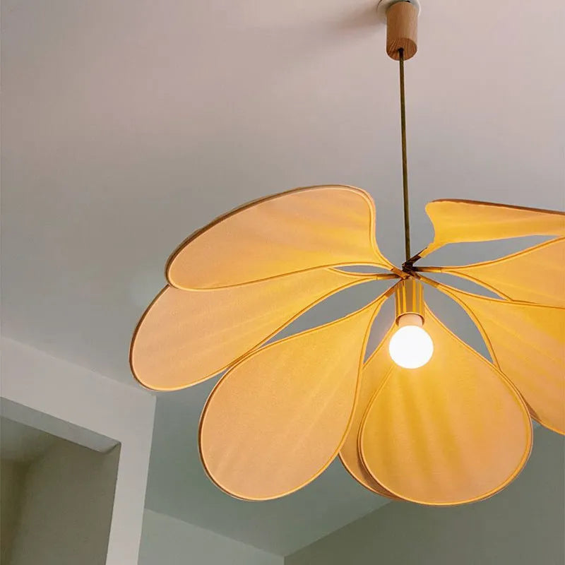 A cloth-craft hanging lamp in log wind Bohemian style, showing fabric texture and soft light diffusion.