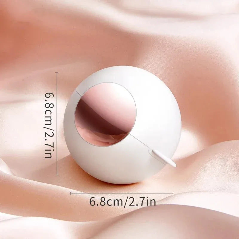 Washable reusable lint roller ball with handle for removing pet hair from fabrics.