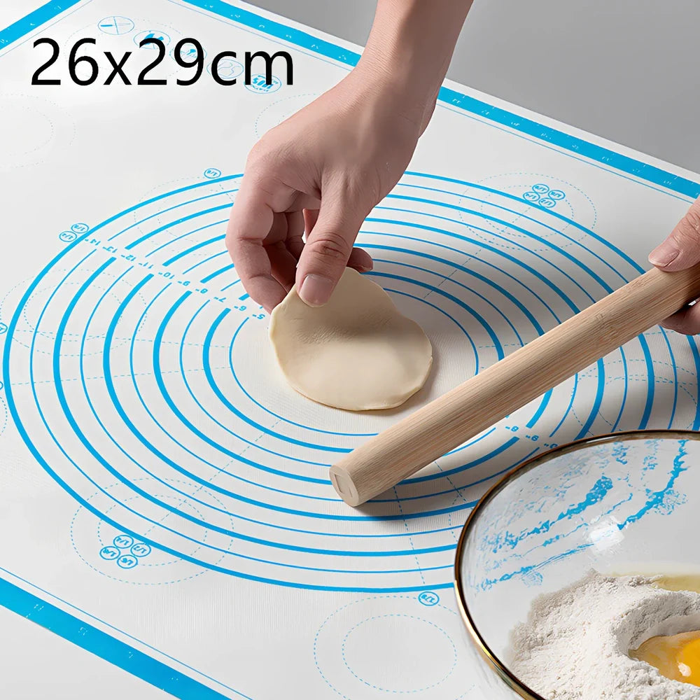 40x60cm black silicone baking mat with measurement guides on kitchen counter