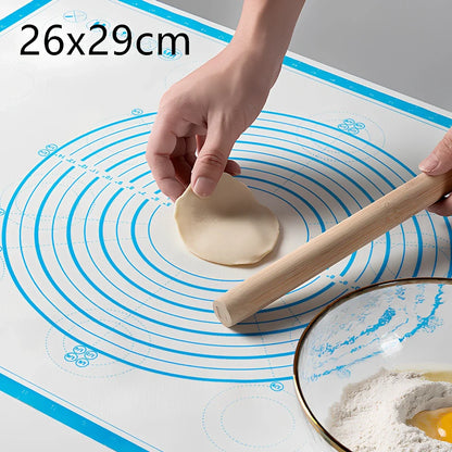 40x60cm black silicone baking mat with measurement guides on kitchen counter
