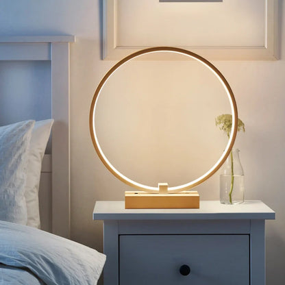 Modern 25cm diameter white LED bedside lamp with acrylic frame and iron base, emitting cool or warm white flicker-free light