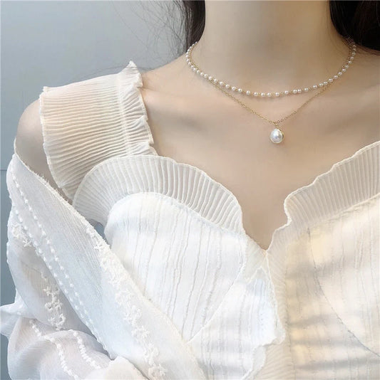 Elegant double-layer pearl necklace for women in gold, showcasing sophisticated design and high-quality craftsmanship.