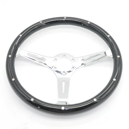 Black classic car steering wheel with peach wood construction and electroplated finish