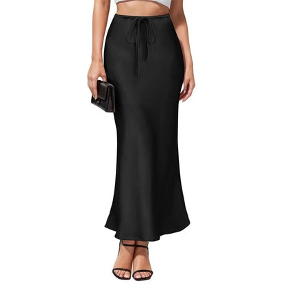 Asymmetric high waist acetate skirt with irregular stitching in multiple colour options.