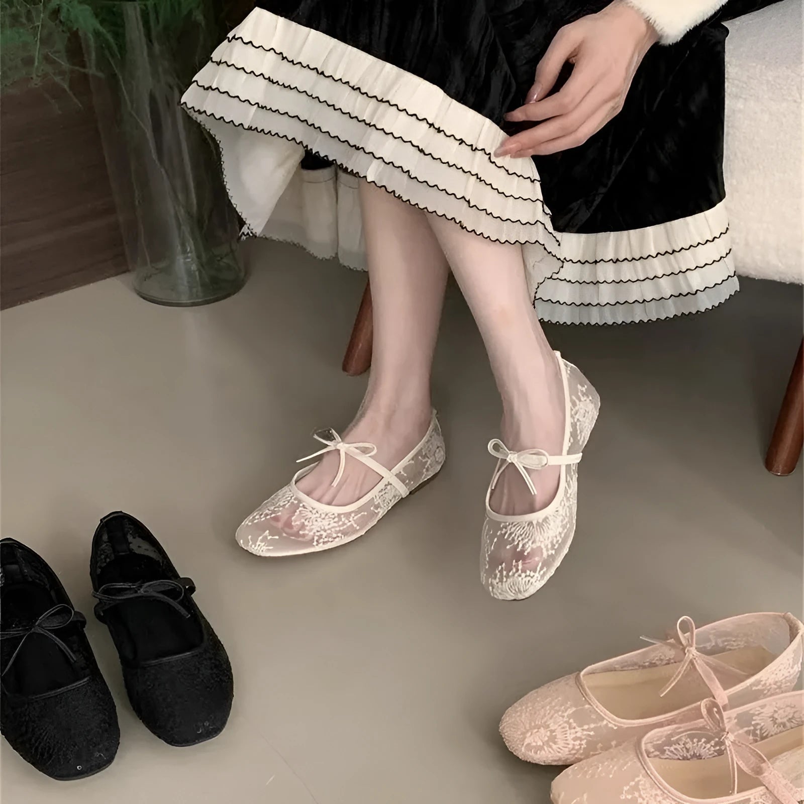 Pink Mary Jane evening shoes with flat lace, mesh upper, and a mid heel on a rubber sole.